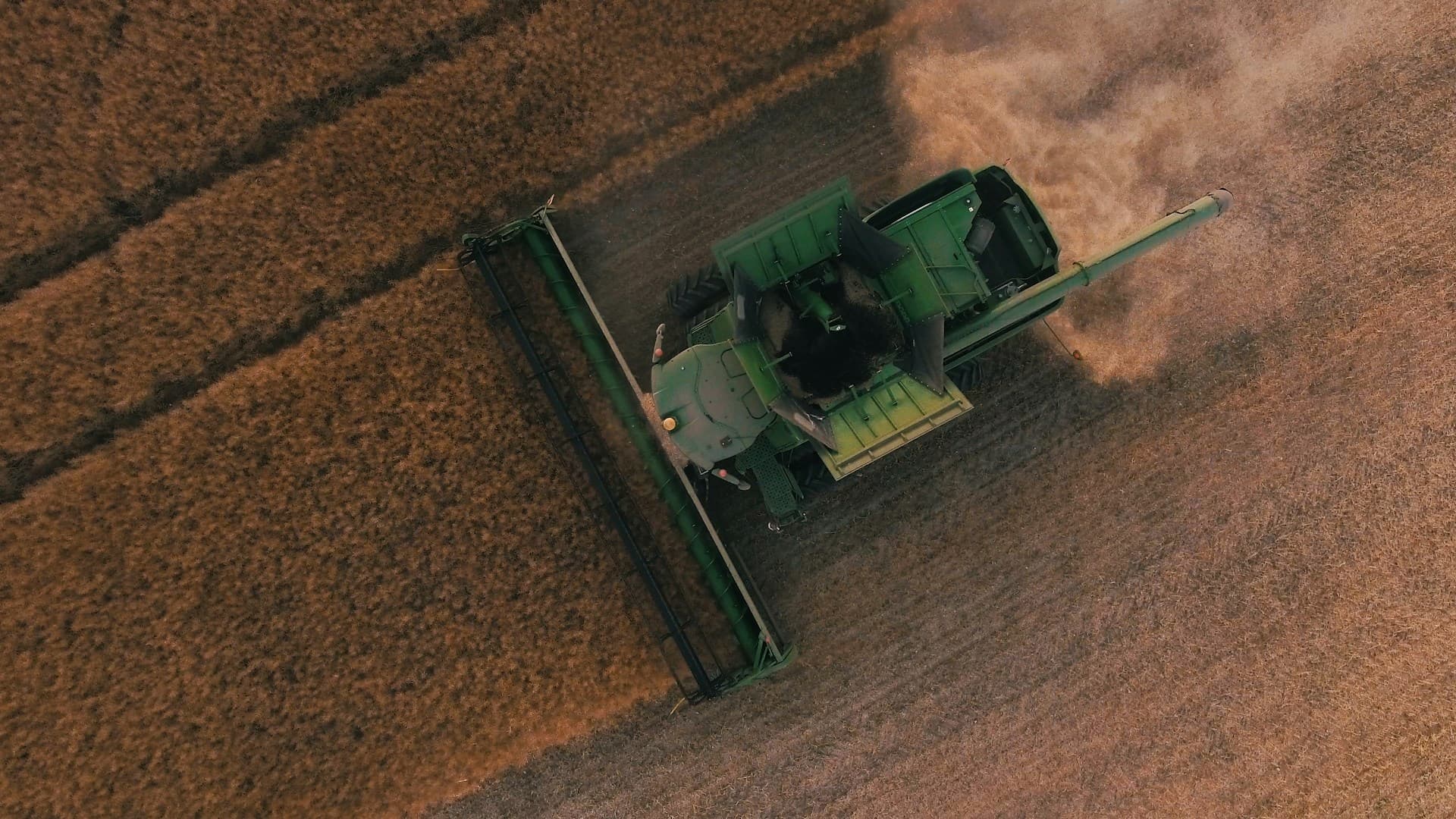 hero image of farmer field with wind turbines